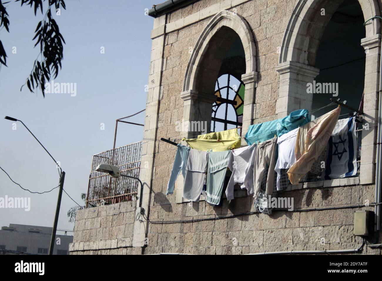Laundry that dries with an israeli flag at balcony of an old house in West Jerusalem. Israel Stock Photo