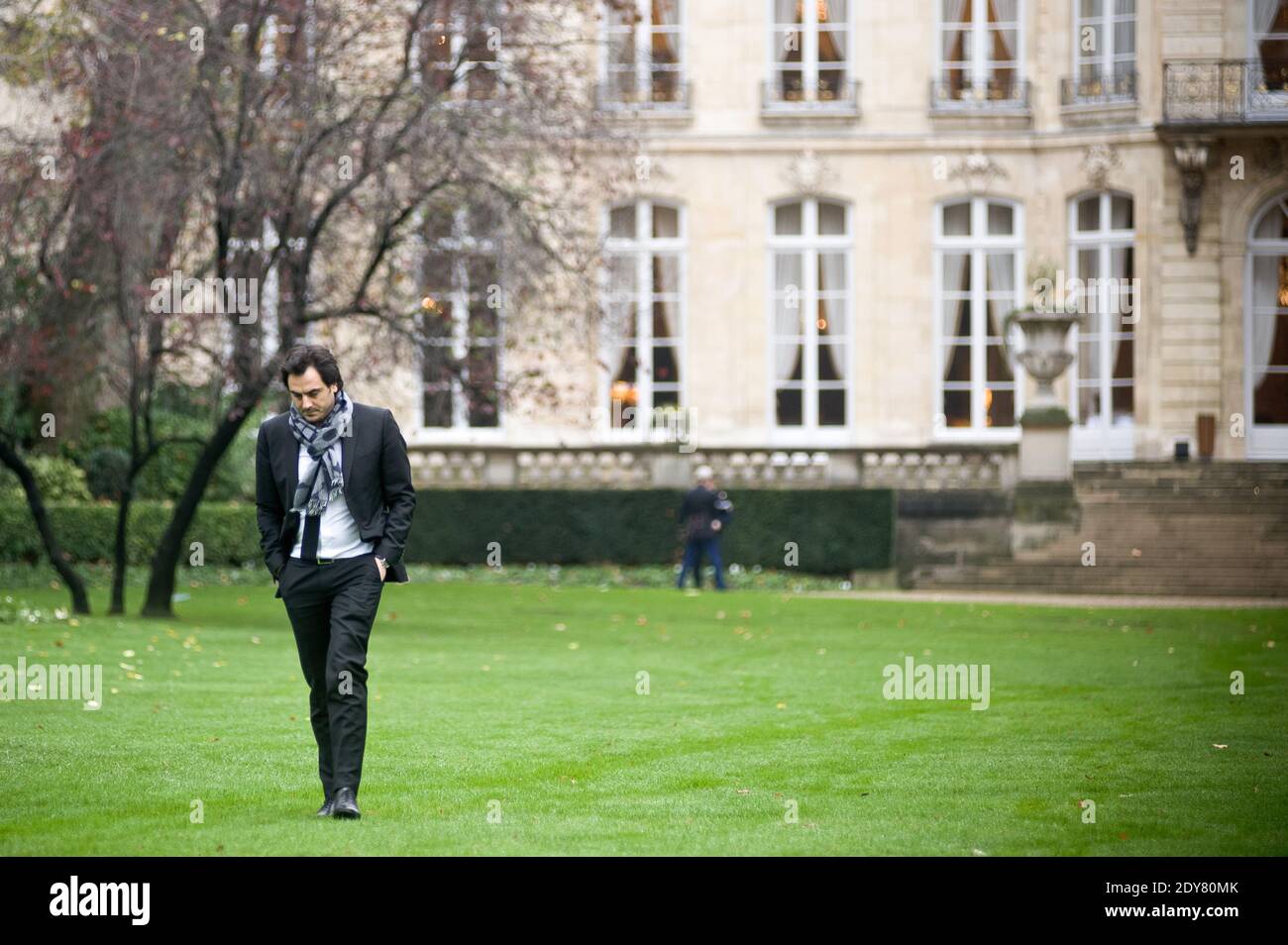 Harold Hauzy, the communication advisor to French Prime Minister Manuel Valls arrives for the planting of the tree called 'of the Prime Minister' - as is the republican tradition - in the gardens of his headquarters Hotel de Matignon in Paris, France on December 16, 2014. The tree, chosen by the Prime Minister, is an oak of the species 'Quercus robur fastigiata' and is located on the front lawn. The tradition of planting a tree at the PM's headquarters was introduced by the late Prime Minister Raymond Barre in 1978. Photo Pool by Nicolas Messyasz/ABACAPRESS.COM Stock Photo