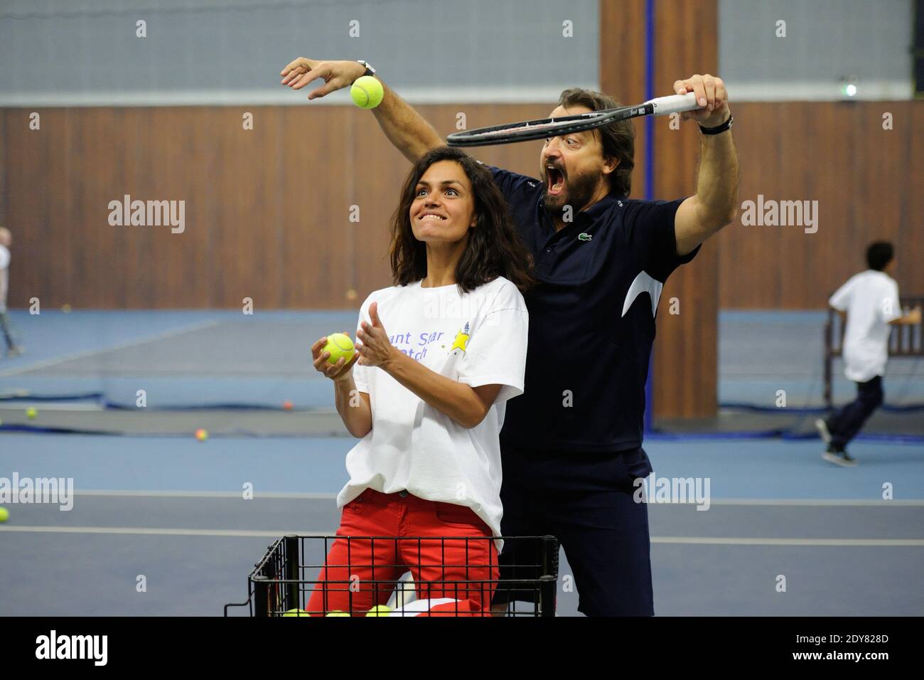 Laurence Roustandjee, Henri Leconte attending Sourire Gagnant event by  Enfant Star and Match association at Levallois