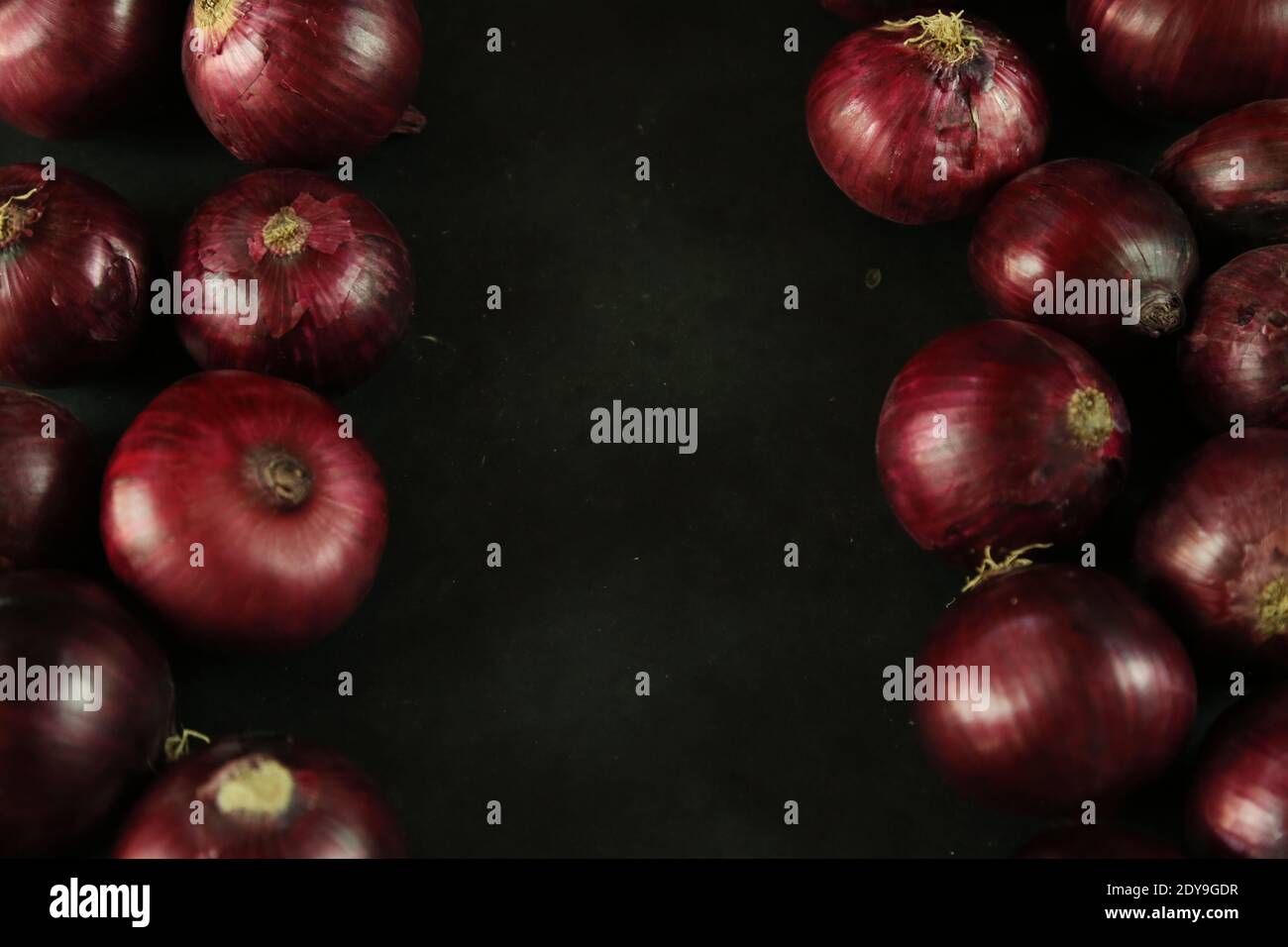 sweet red onions on background Stock Photo