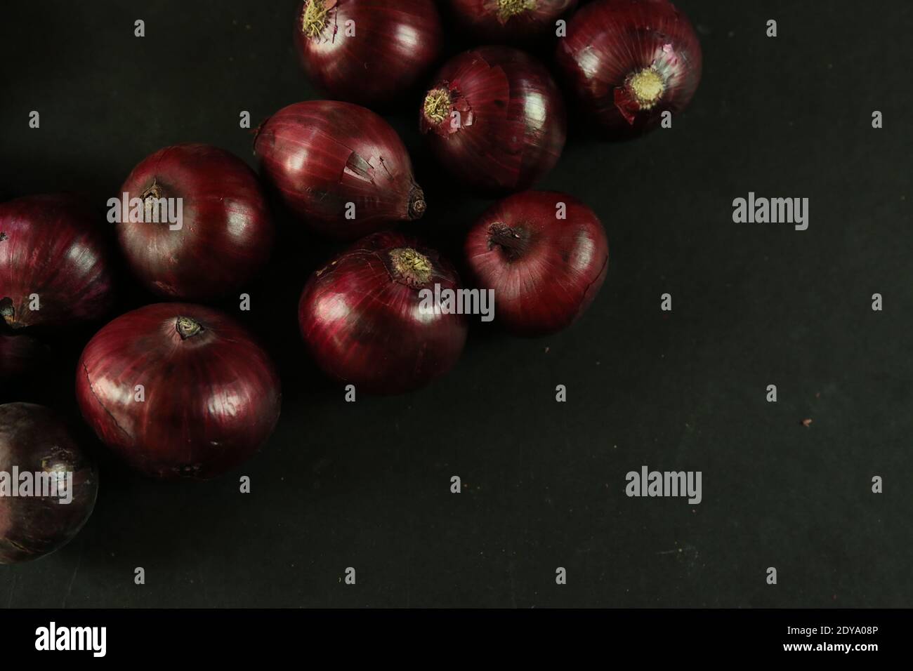 sweet red onions on background Stock Photo