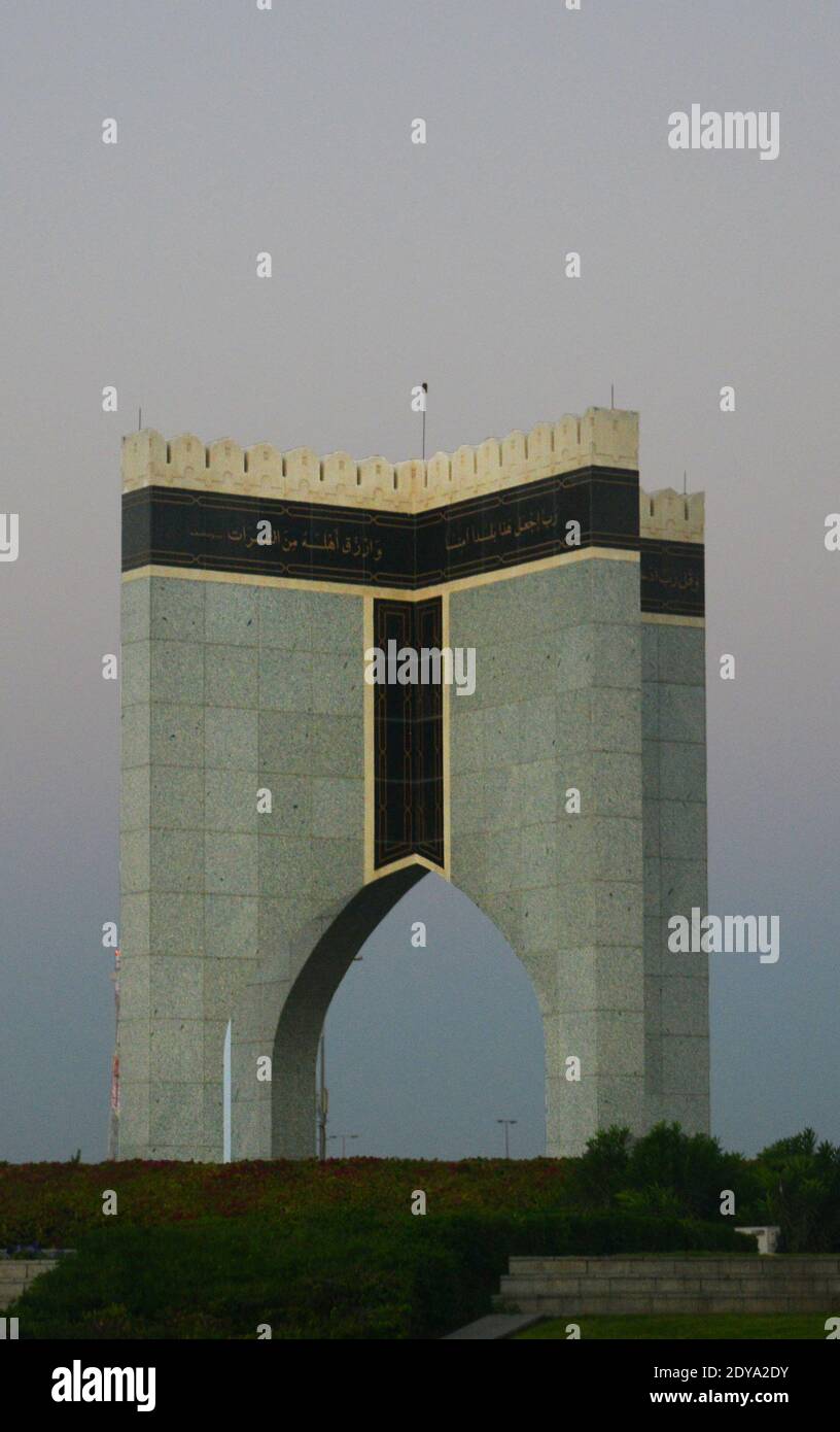 Omani gate on a coastal roundabout in greater Muscat, Oman. Stock Photo