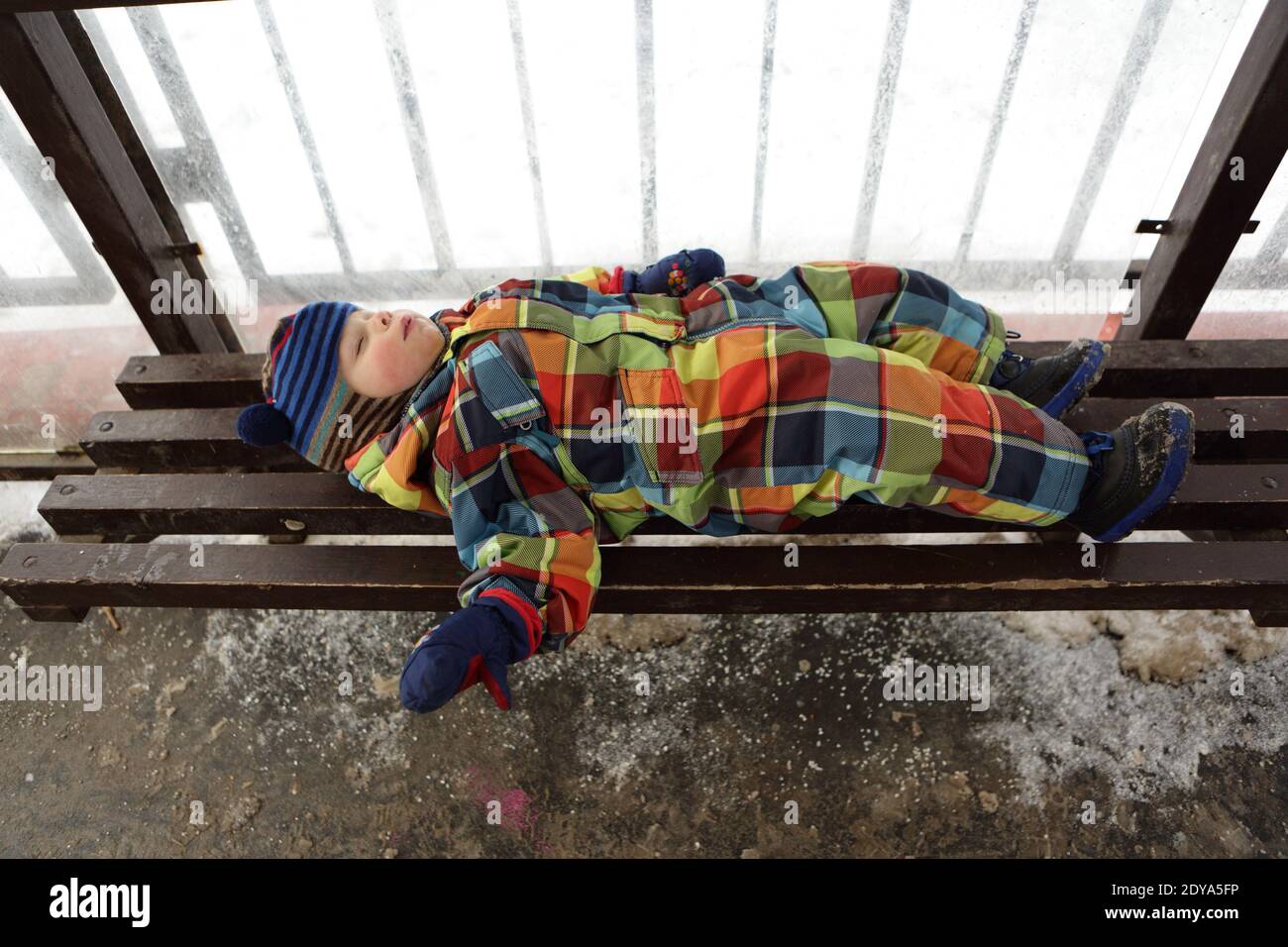Boy sleeping on bench hi-res stock photography and images - Alamy