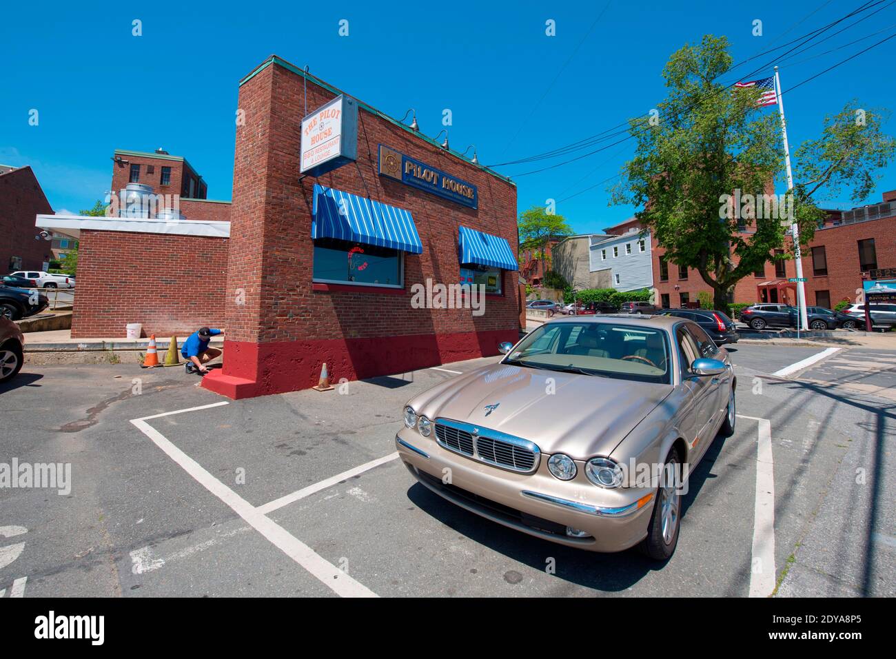 Historic commercial buildings and antique Jaguar car on Rogers Street