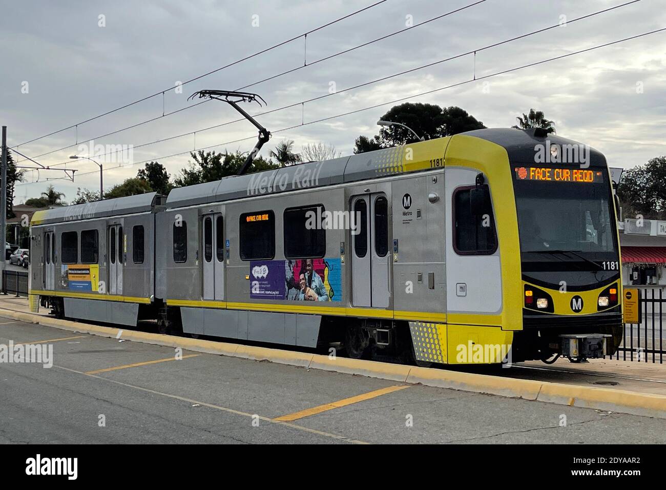 A Metro Rail Gold Line (L-Line) train with face mask required sign amid the global coronavirus COVID-19 pandemic, Thursday, Dec. 24, 2020, in Los Ange Stock Photo