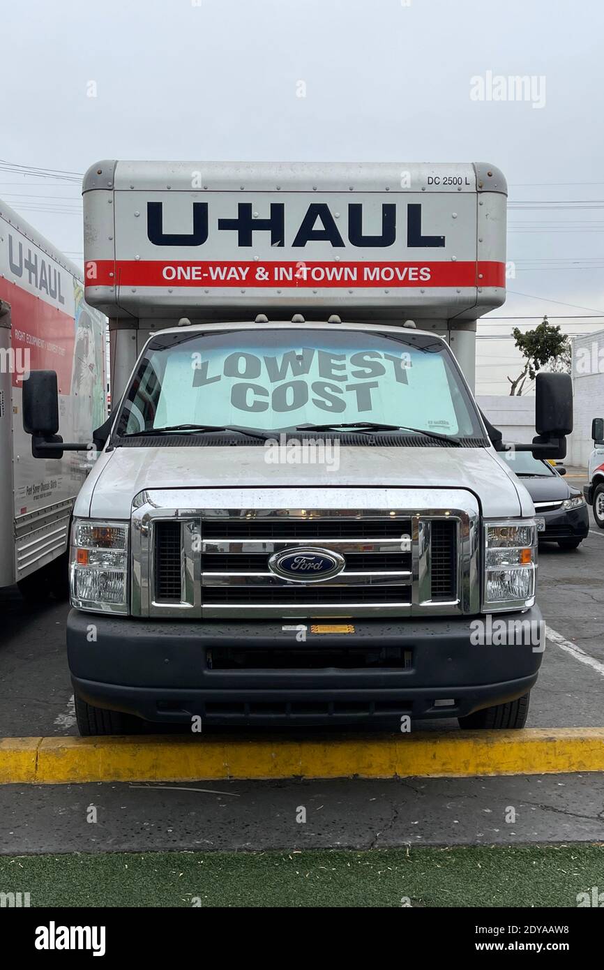 U-Haul rental moving trucks are seen, Thursday, Dec. 24, 2020, in Los Angeles. (Kirby Lee via AP) Stock Photo