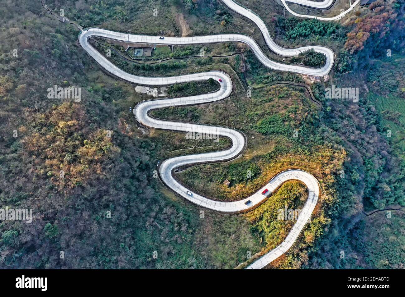 An aerial view of the winding cliff highway (Guzhang Highway) looking like a silver snake in Wangjiafan town, Yidu city, central China's Hubei provinc Stock Photo