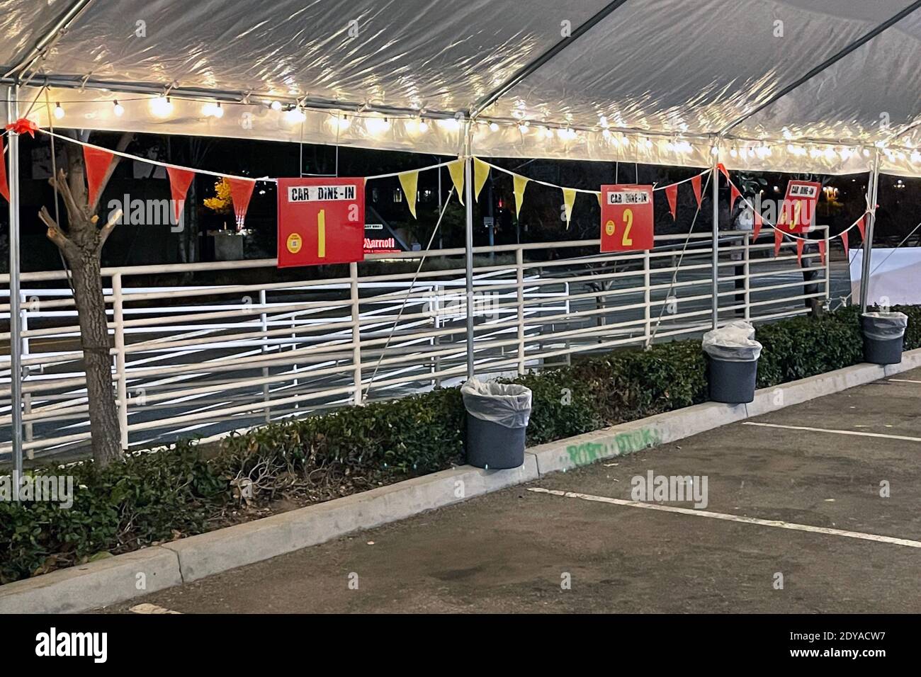An outdoor dining area at Denny's Restaurant converted into a car dine-in area amid the global coronavirus COVID019 pandemic, Sunday, Dec. 18, 2020, i Stock Photo