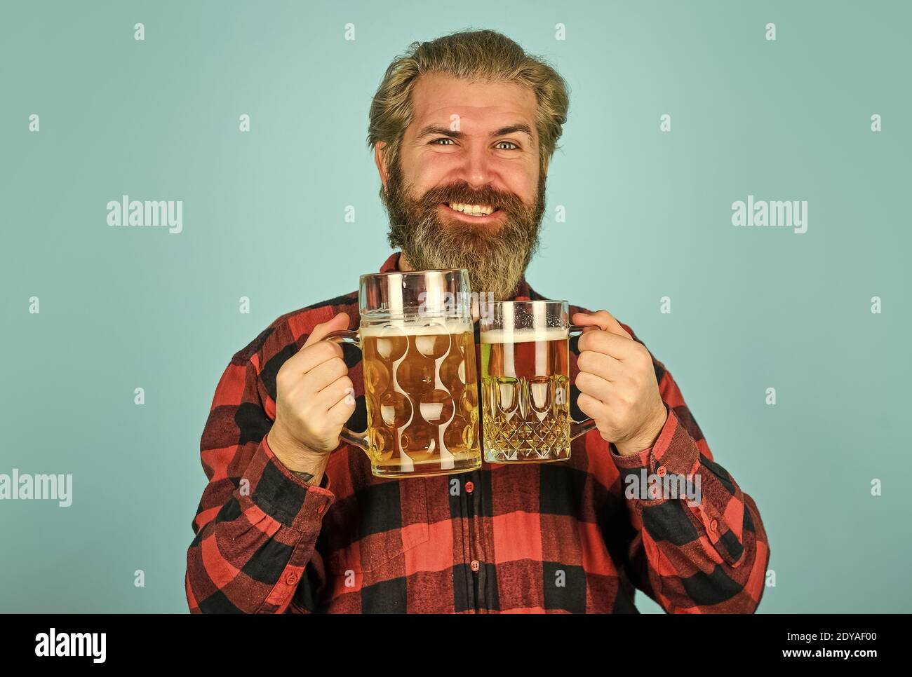 lets celebrate. enjoying glass of beer at pub. anticipating fresh cold lager beer. after hard working day. drink draft beer at bar counter in pub. relaxed handsome man sipping delicious beer. Stock Photo