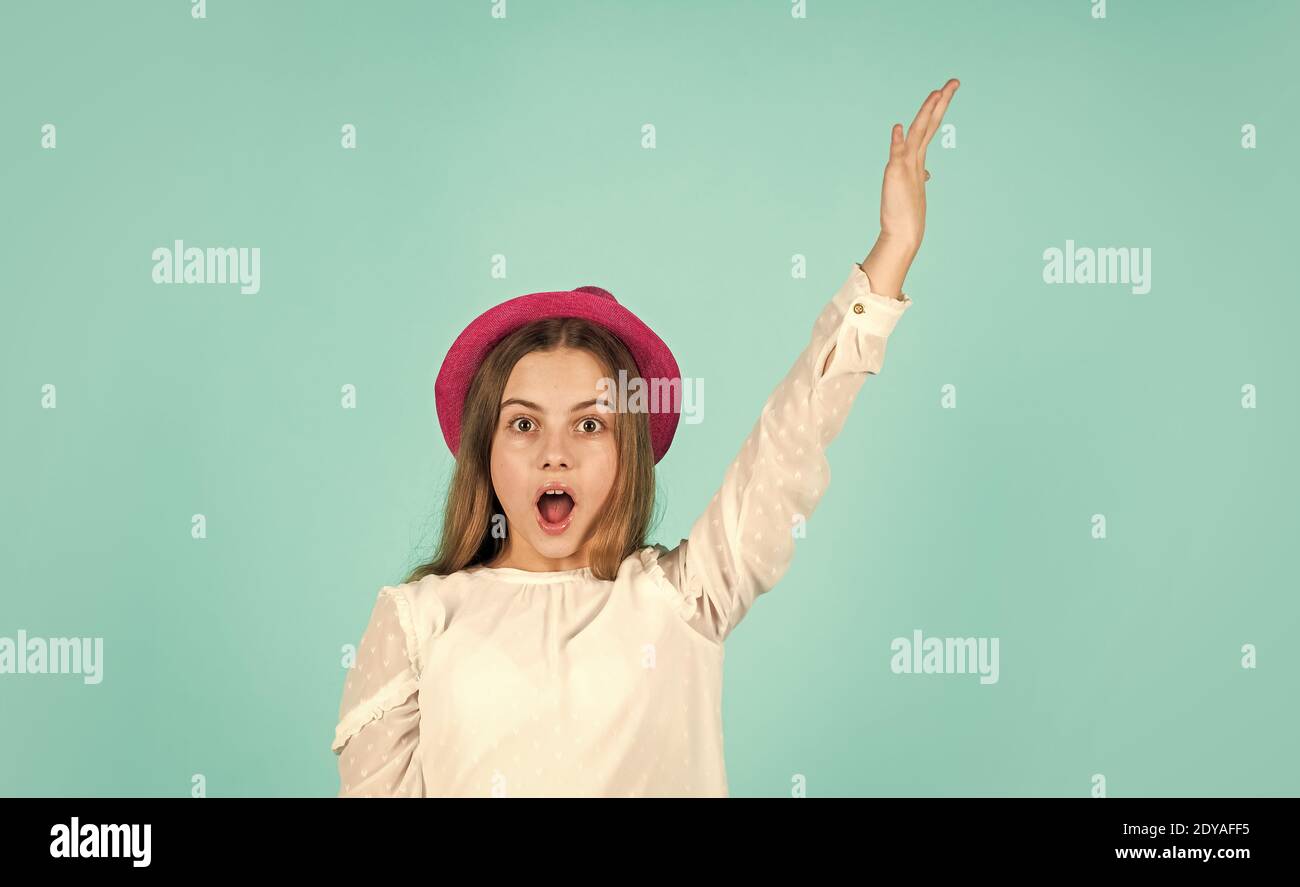Individual style. Girl wear hat blue background. Summer accessory