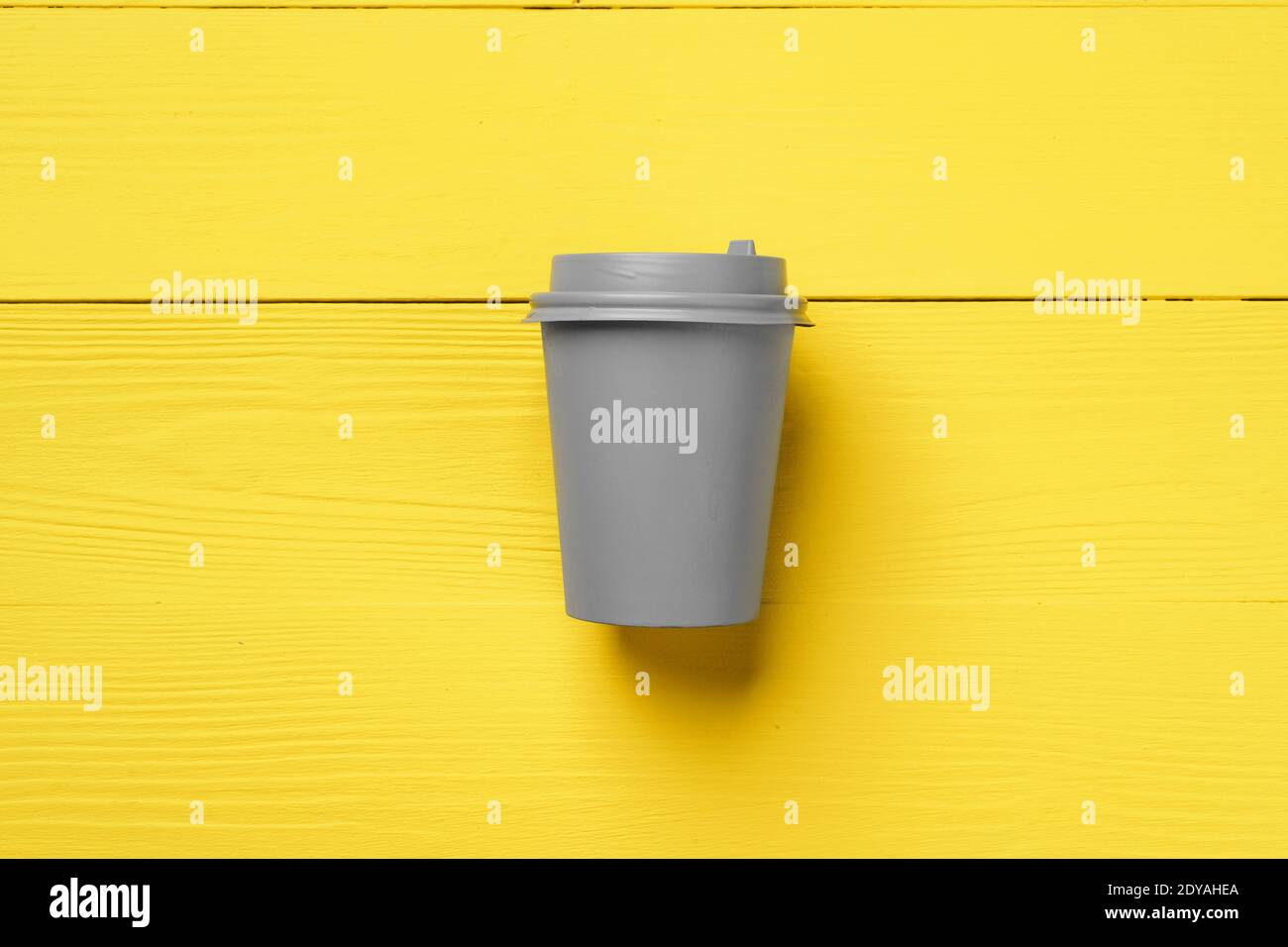 Disposable coffee cup in yellow gray colors Stock Photo Alamy