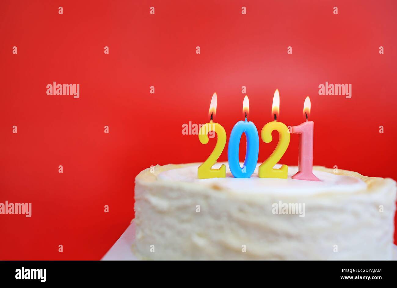 2021 calendar on the cake with red background Stock Photo