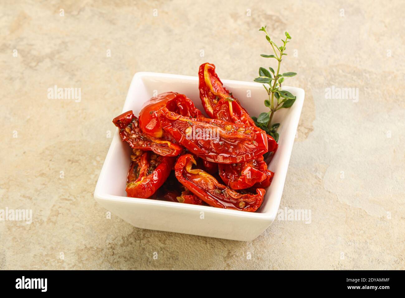 Sundried tomato in olive oil with herbs and spices Stock Photo Alamy
