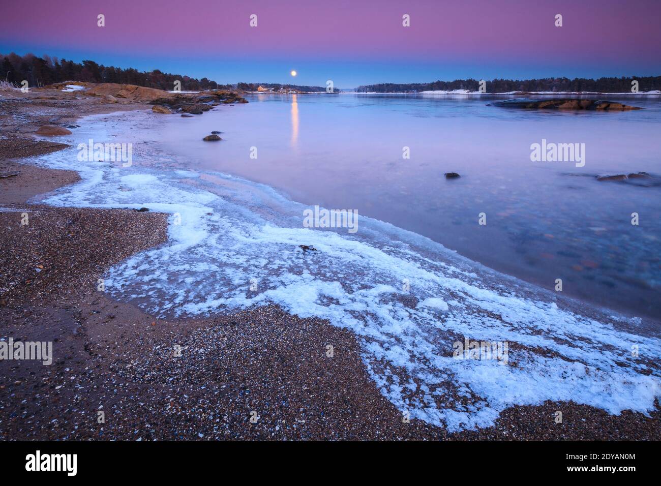 Beautiful winter evening with moonrise and earth shadow, at Oven in Råde, by the Oslofjord, Østfold, Norway. Stock Photo