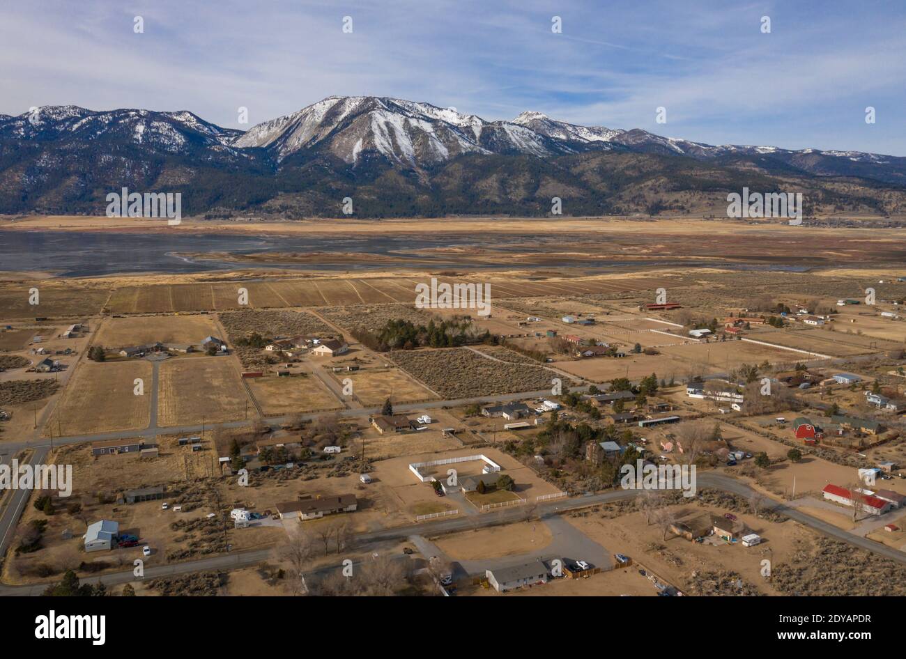 NEW WASHOE CITY, NEVADA, UNITED STATES - Dec 24, 2020: Homes in the community of New Washoe City spread out beneath Slide Mountain and Mt Rose in the Stock Photo