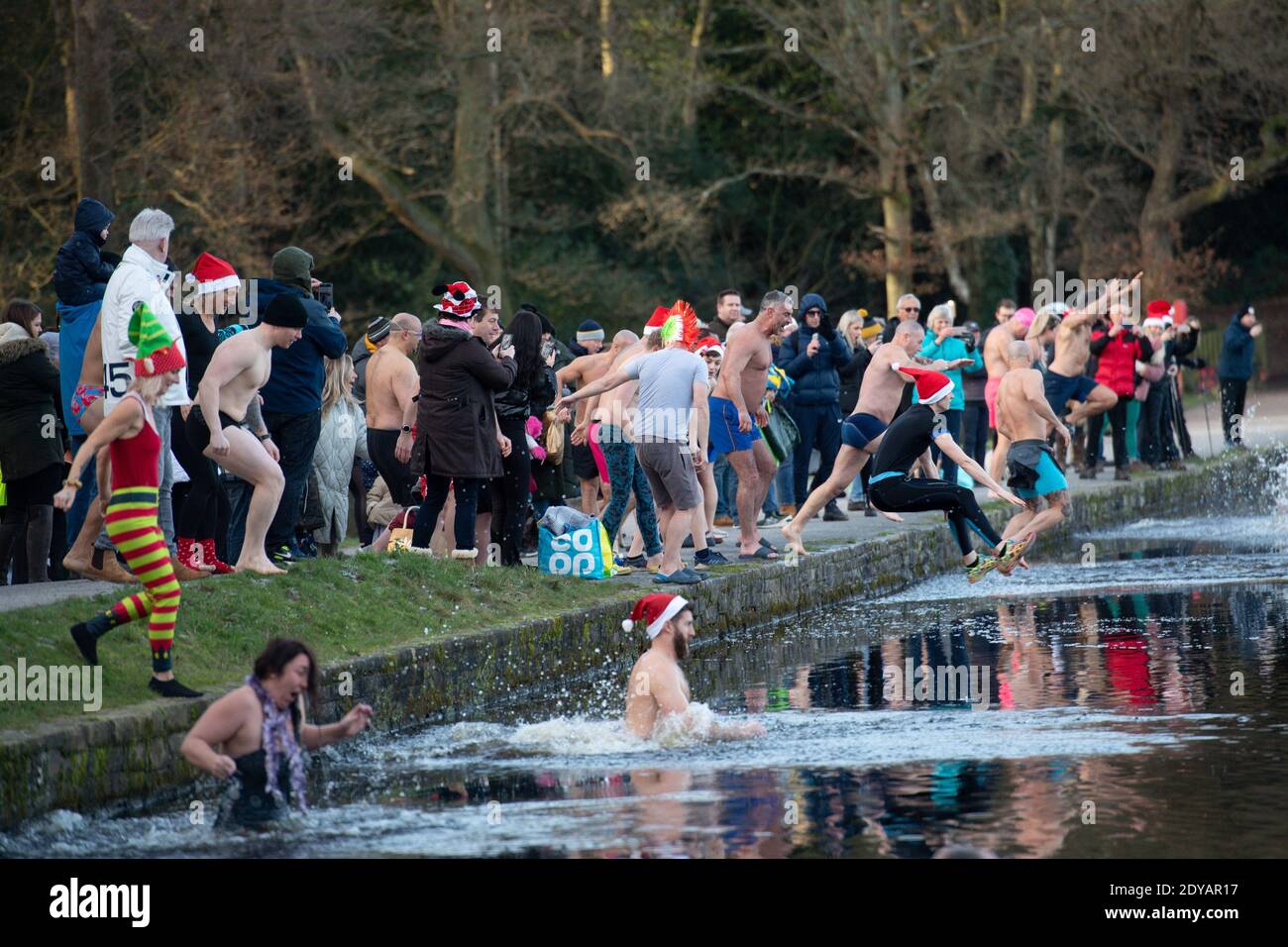 Swimmers take a Christmas Day dip at Blackroot Pool at Sutton Park, in