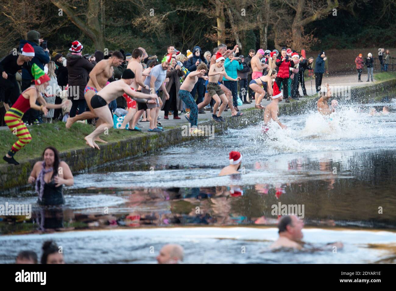 Swimmers take a Christmas Day dip at Blackroot Pool at Sutton Park, in
