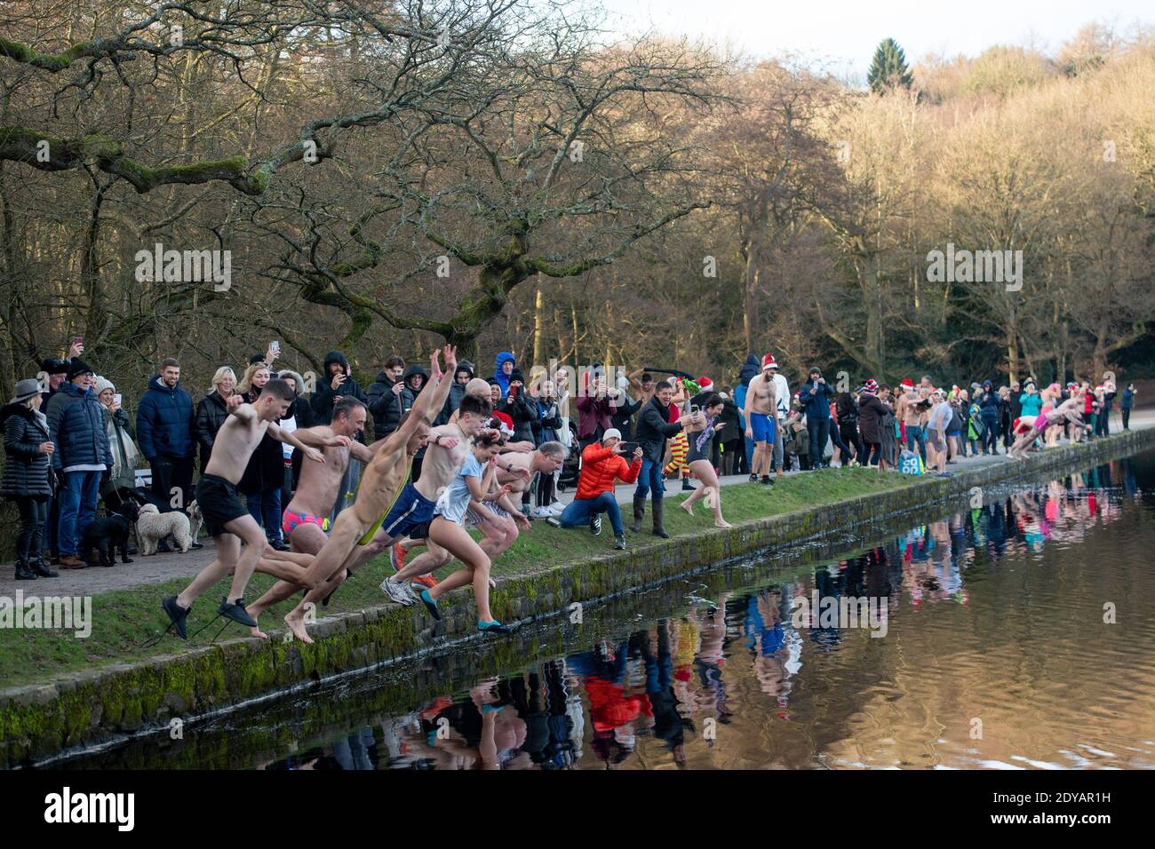 Swimmers take a Christmas Day dip at Blackroot Pool at Sutton Park, in
