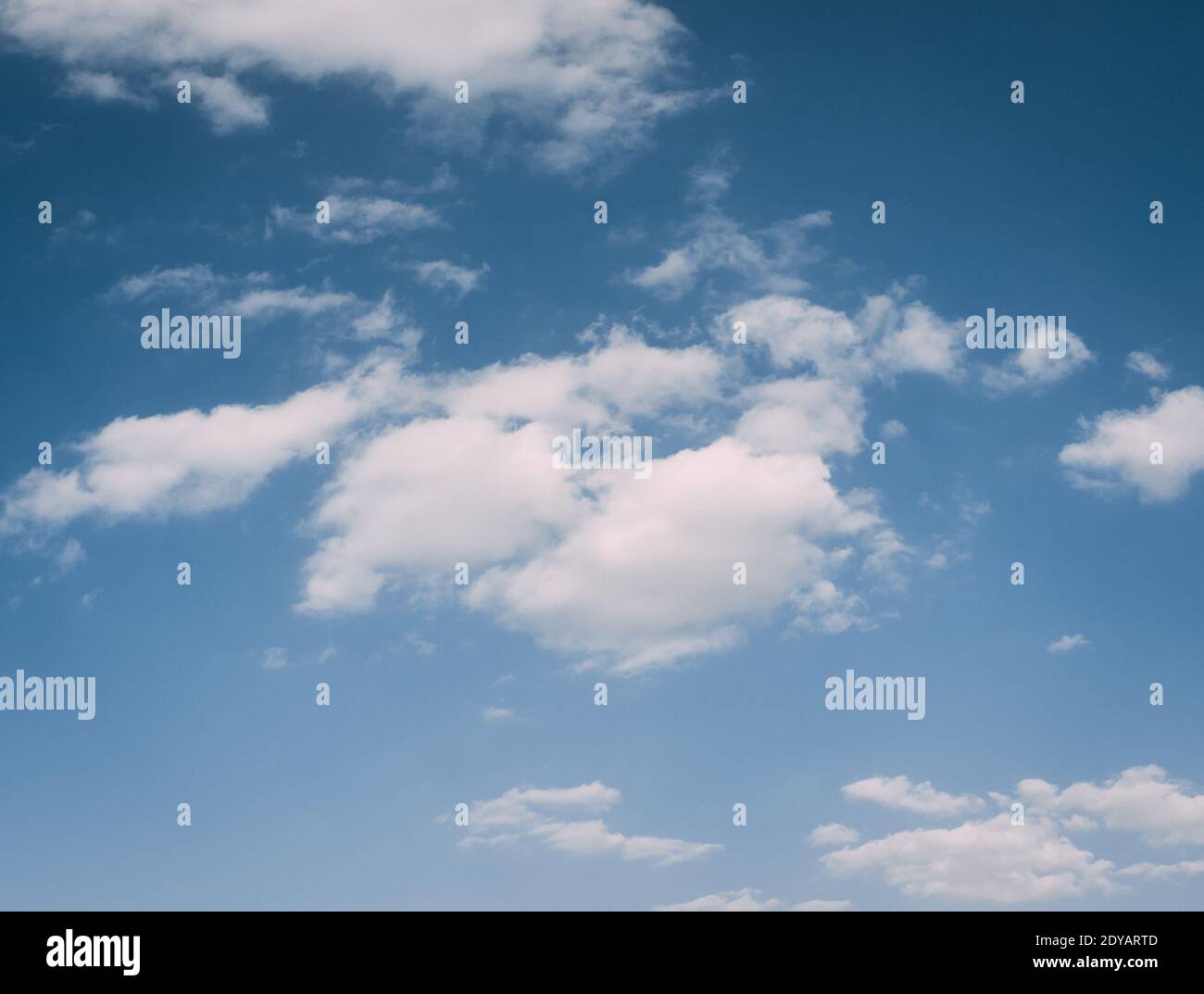 The fluffy clouds in the blue sky Stock Photo - Alamy