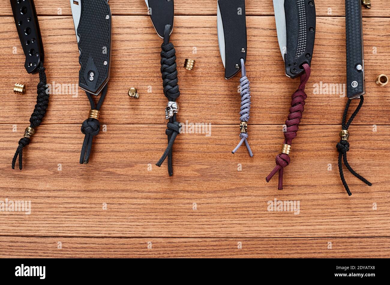 Set of pocket knives decorated with various paracord lanyards Stock Photo -  Alamy