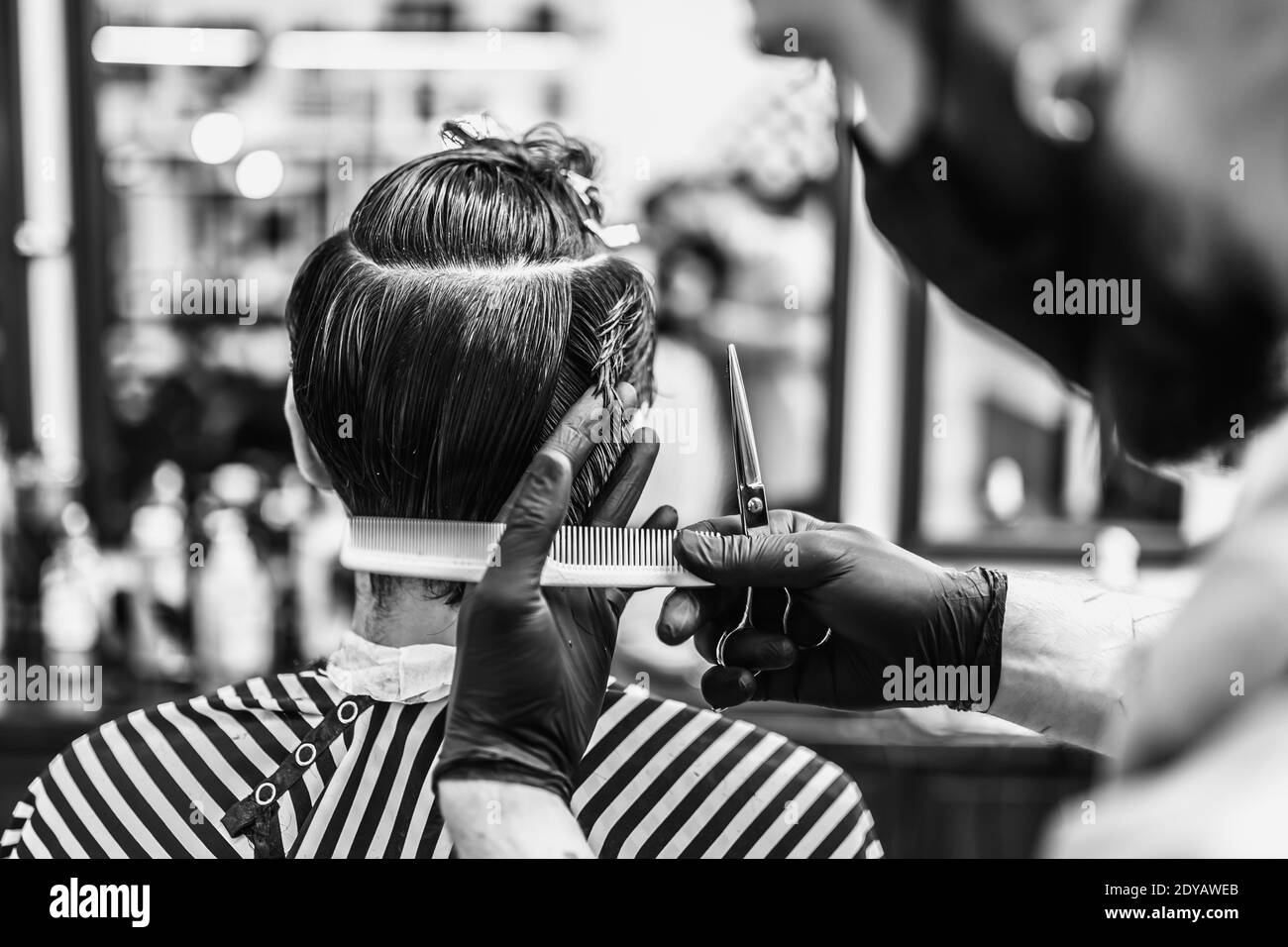 Hairdresser makes haircut Black and White Stock Photos & Images Alamy