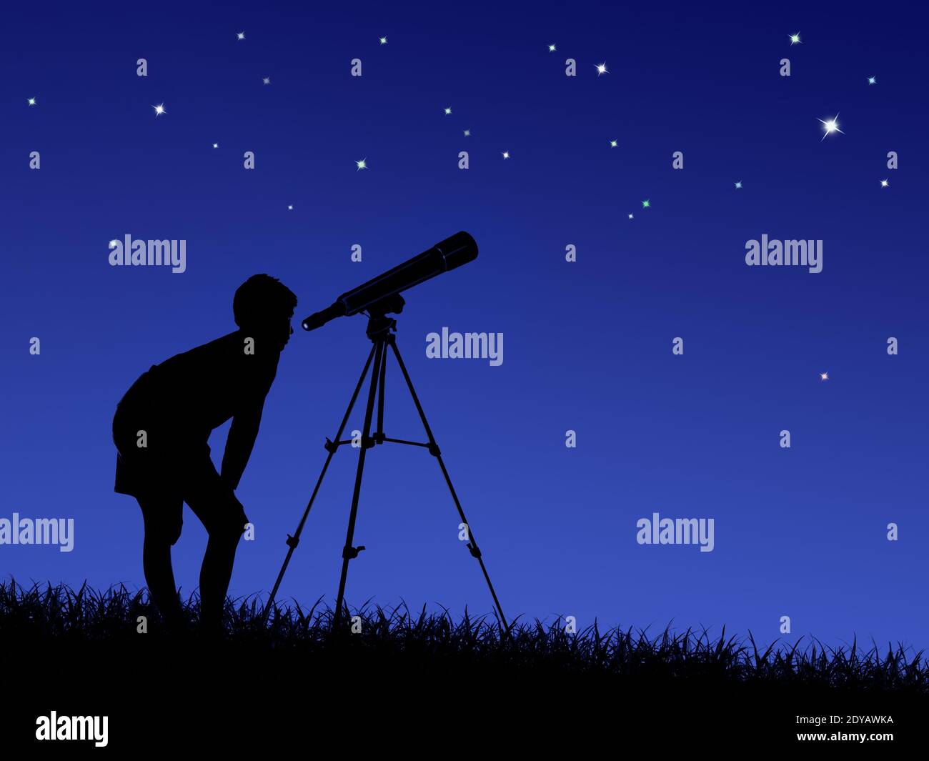 the boy looks at the stars through a telescope on the lawn Stock Photo