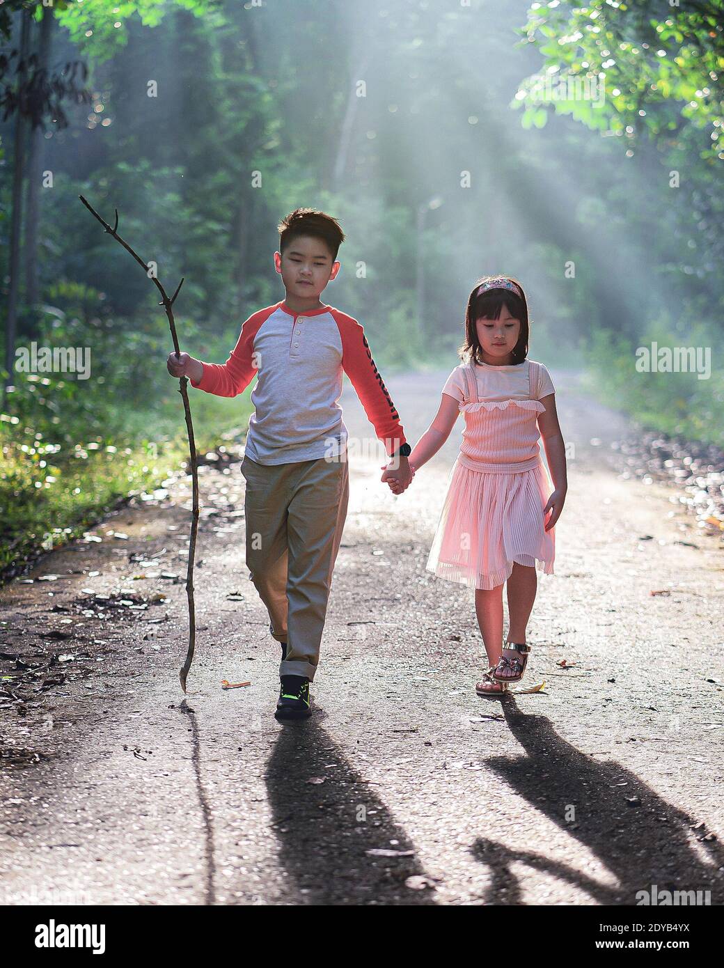 Two sisters and children and shadow hires stock photography and images