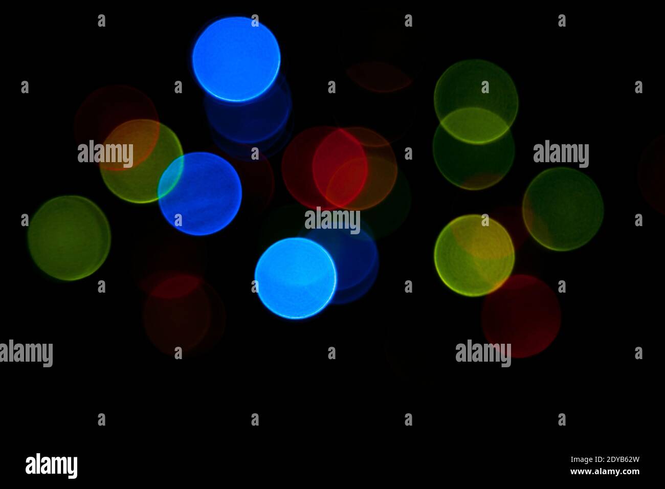 Colorful bokeh lights texture on a dark background Stock Photo
