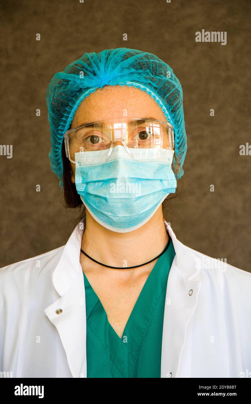 Woman Doctors Portrait, Doctors With Mask, Glasses, Glove And Uniform