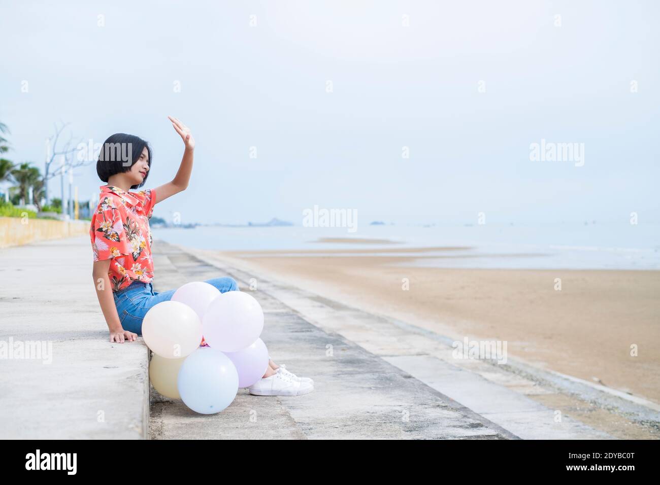 Woman dancing beach jeans hi-res stock photography and images - Alamy