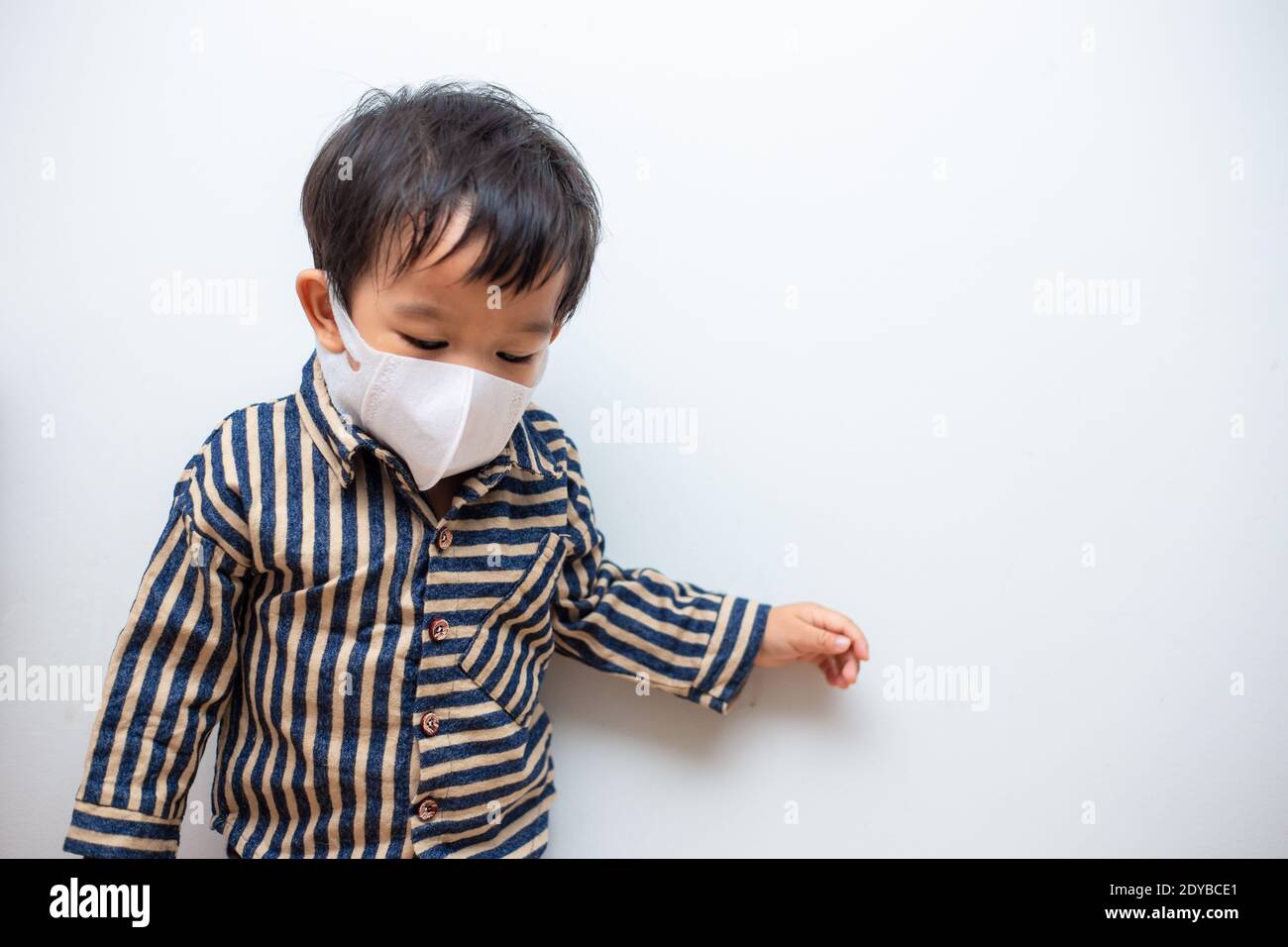 Cute Boy Wearing Mask Against White Background Stock Photo Alamy