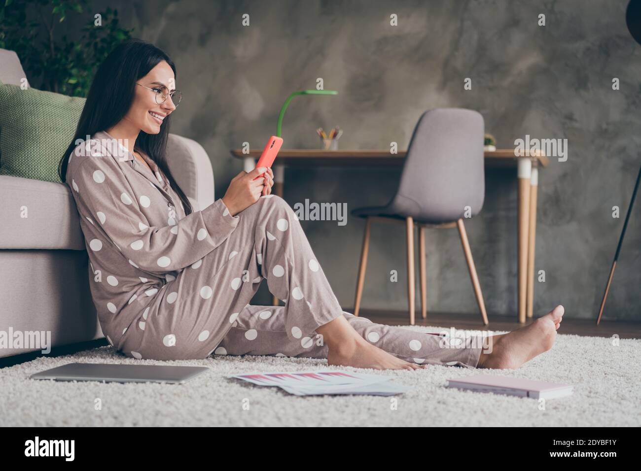 Profile photo of sweet optimistic girl sit write telephone wear spectacles  pijama at home Stock Photo - Alamy