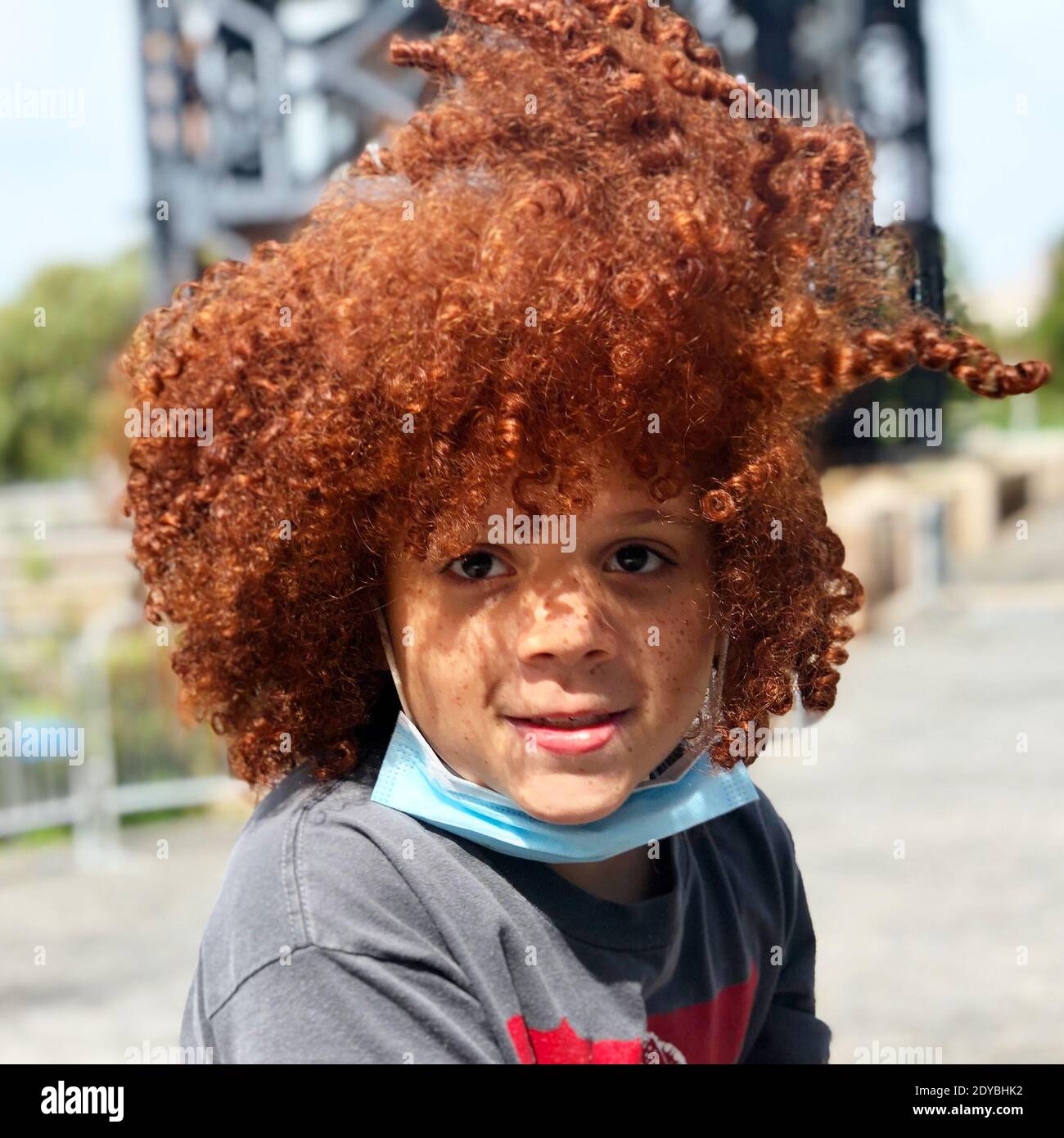 Portrait Of Cute Smiling Boy With Red Hair Outdoors Stock Photo - Alamy