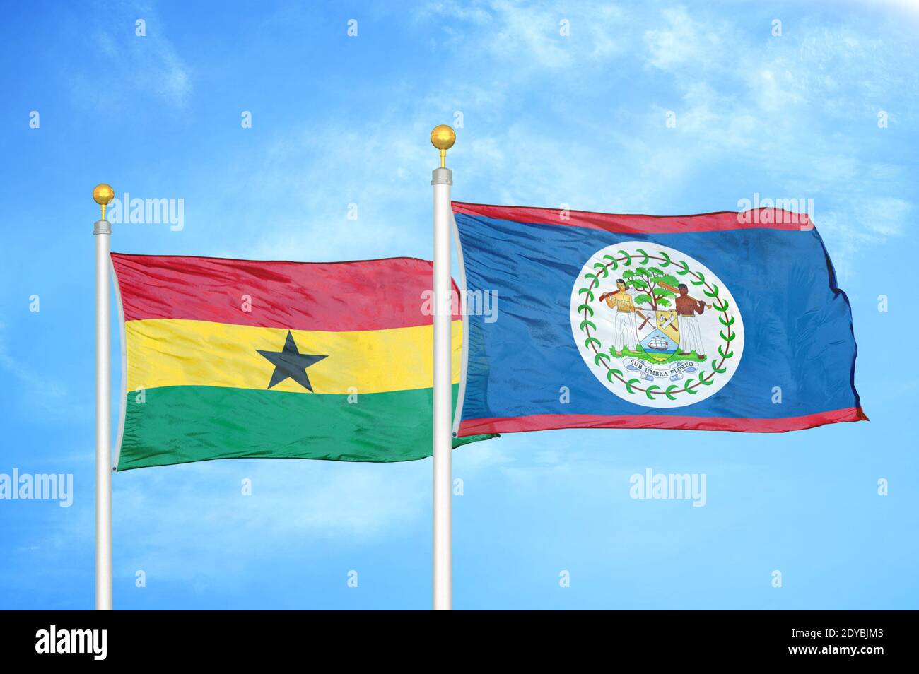 Ghana and Belize two flags on flagpoles and blue sky Stock Photo