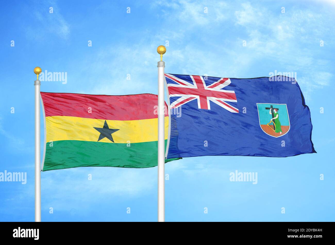 Ghana and Montserrat two flags on flagpoles and blue sky Stock Photo
