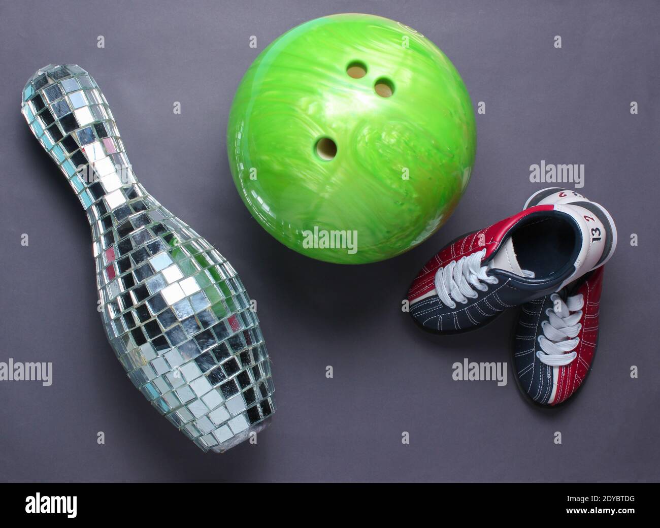 Indoor family sports concept. Bowling shoes, disco mirror skittle and