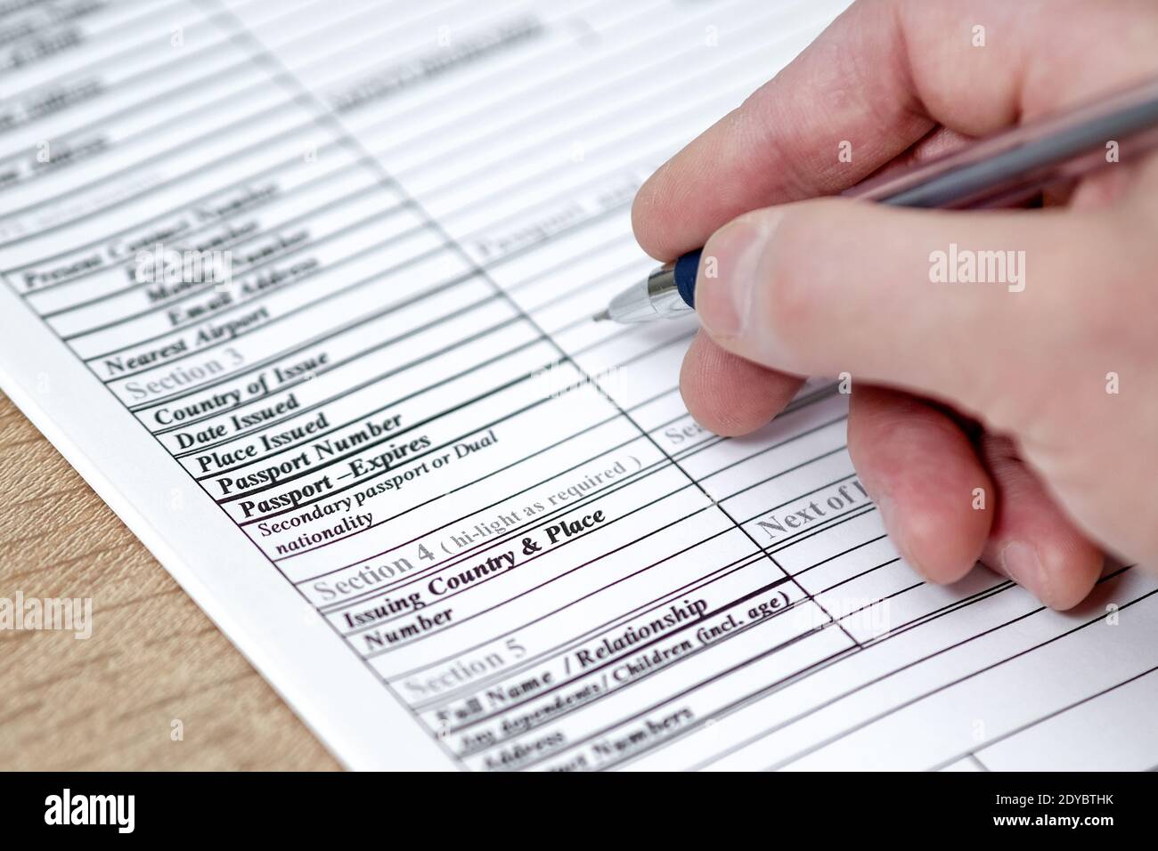 Filling in an application form for visa entry. Stock Photo