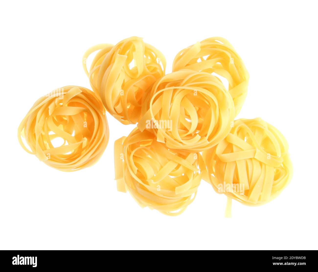 Raw dry tagliatelle noodle isolated on white background Stock Photo Alamy