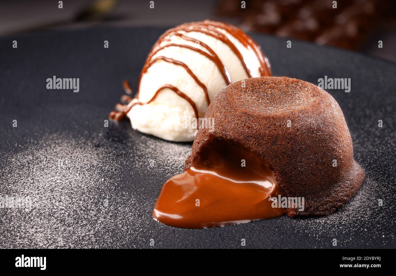 Delicious Petit Gateau Chocolate Cake With Cacao Syrup Vanilla Ice Cream And Mint Leaf Served On White Plate With White Background Stock Photo Alamy
