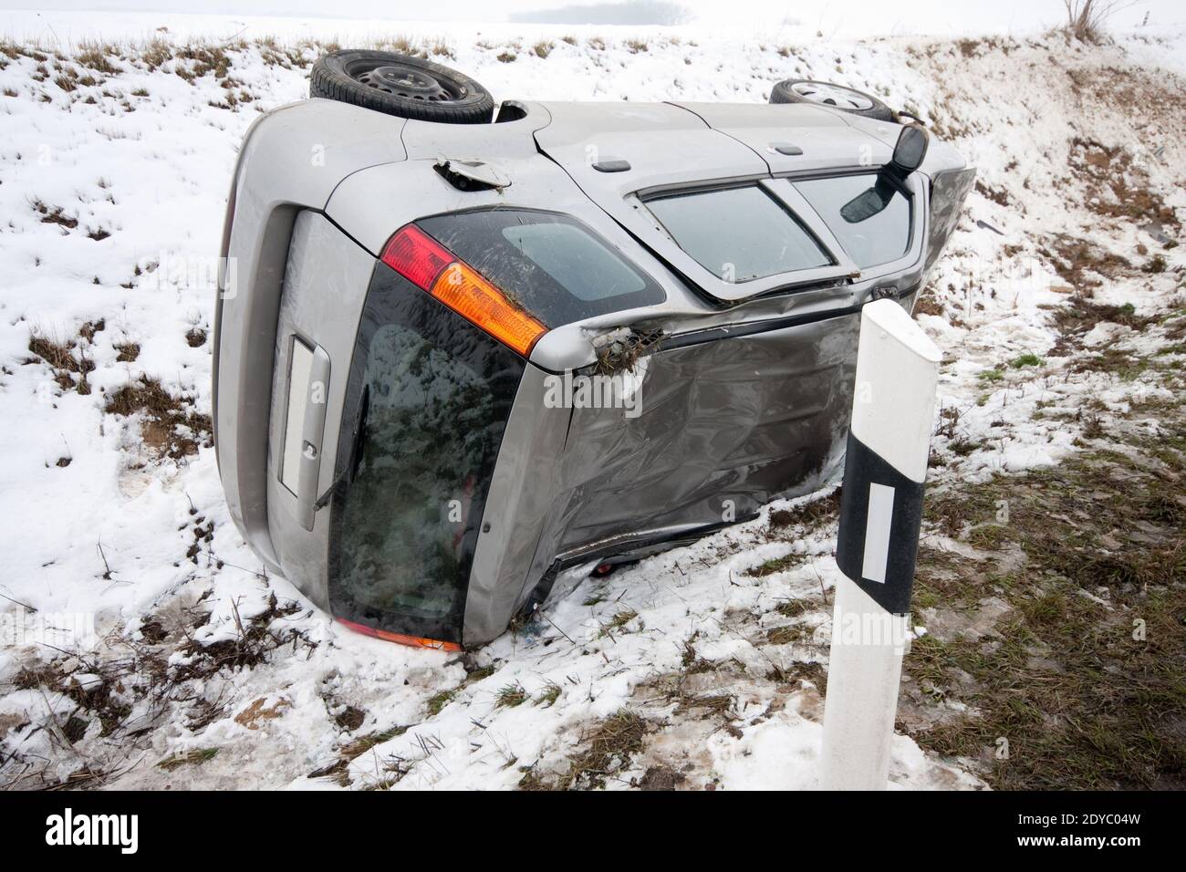 car flipped upside down in accident during winter storm Stock Photo Alamy