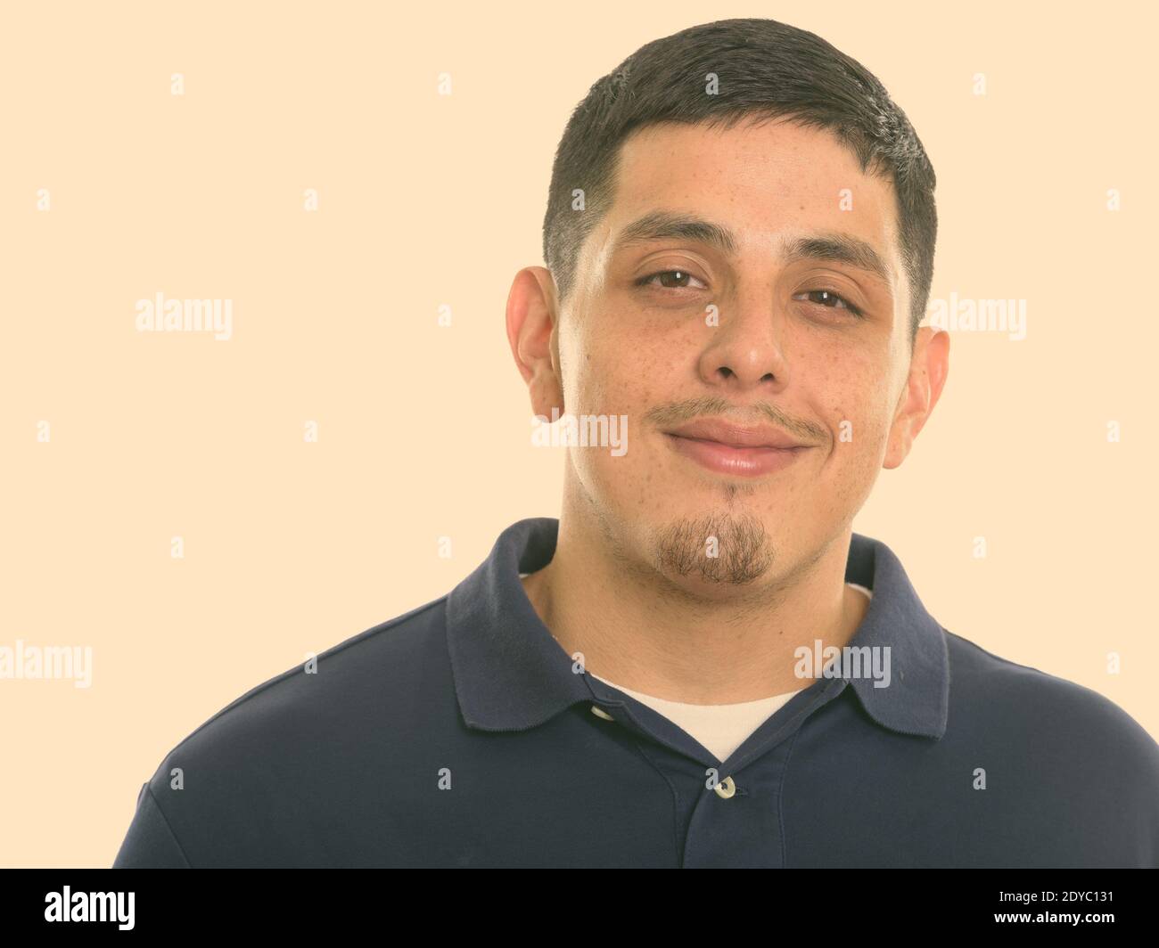 Close up of young Hispanic man smiling and looking at camera Stock ...