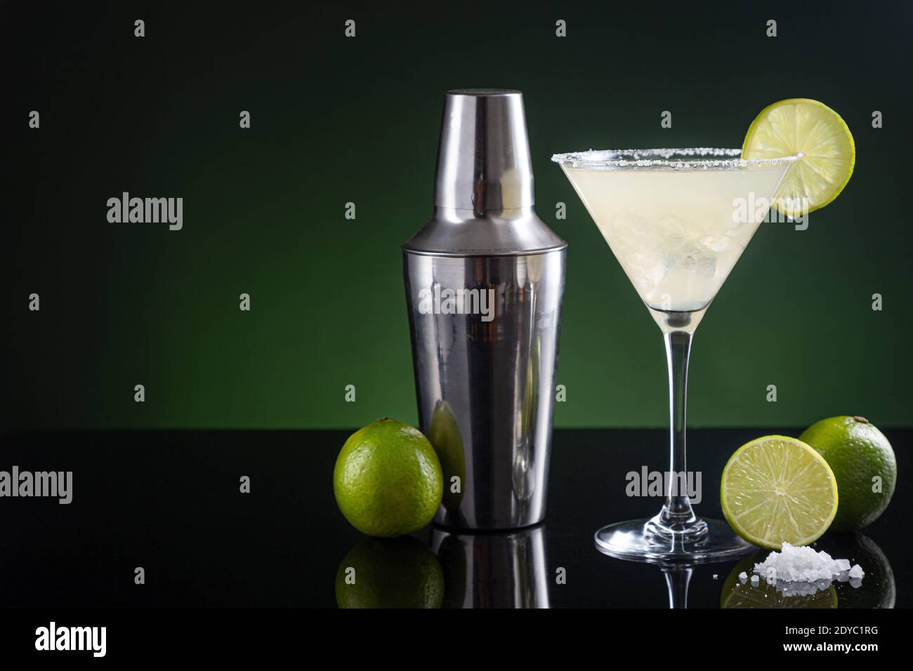 Typical Mexican margarita cocktail with lime slice ice and cocktail