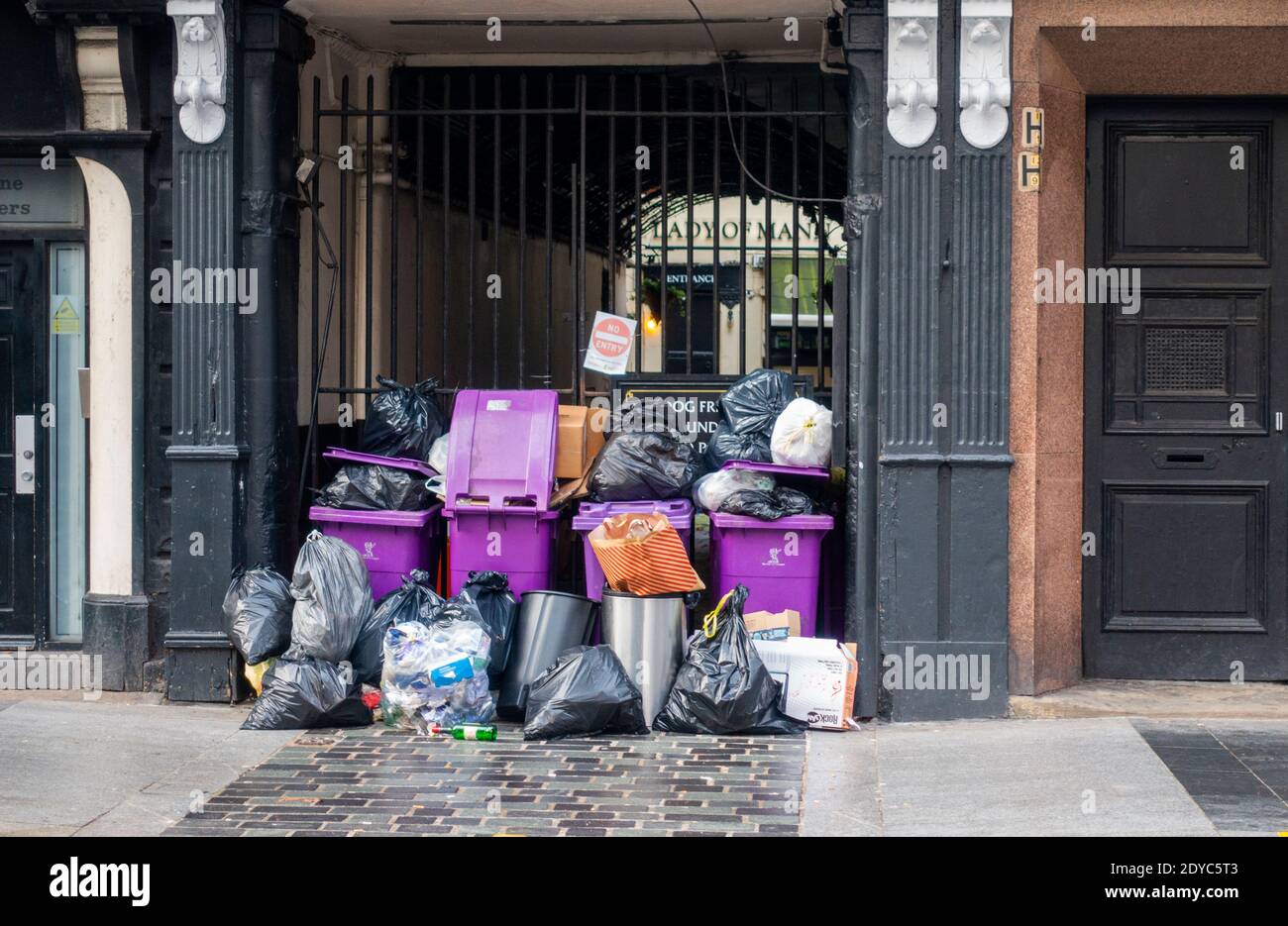 Garbage and trash bins outside a pub on Christmas Day 2020 Stock Photo