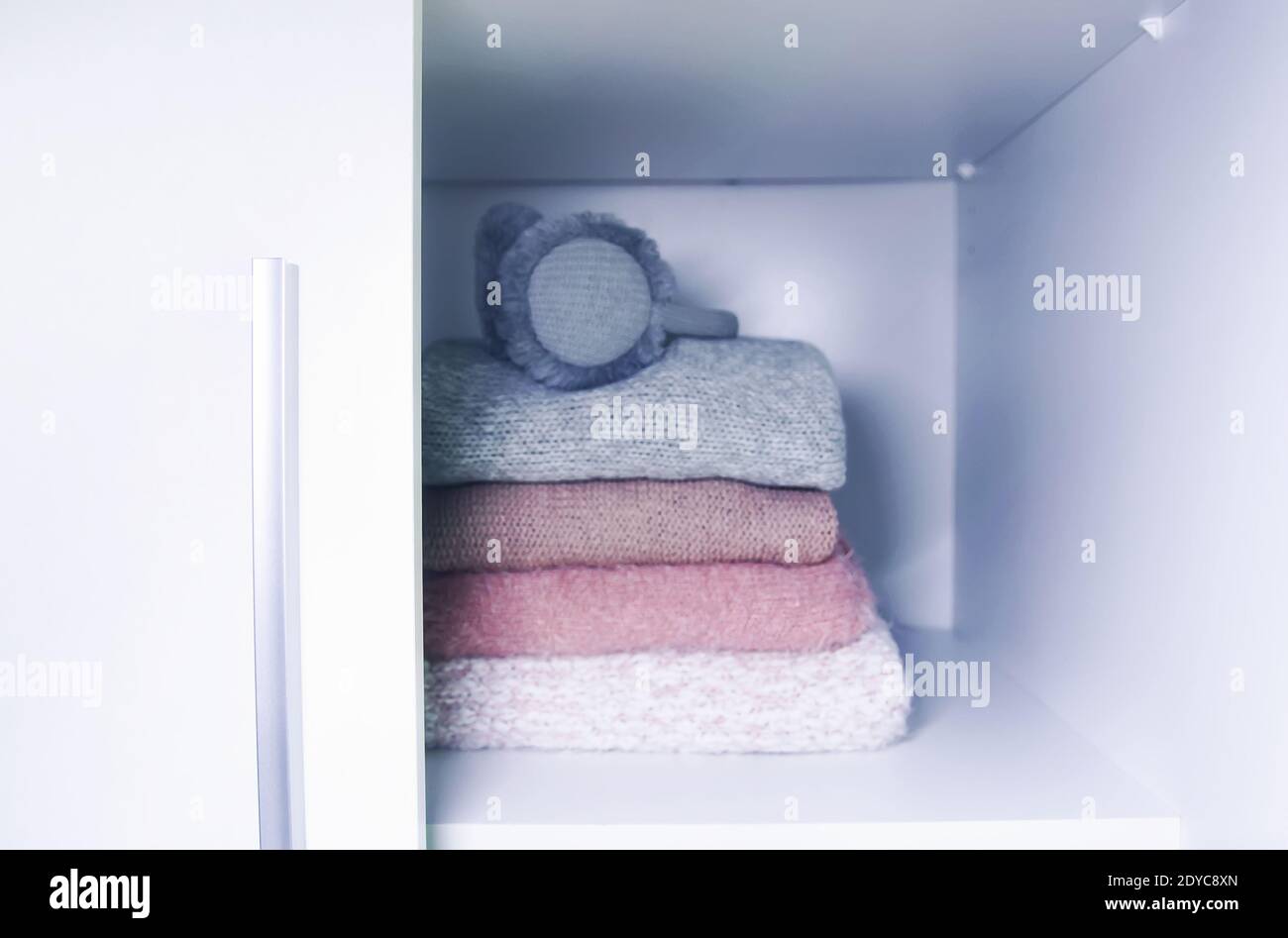Home Wardrobe with Winter Clothes. Woolen Sweaters and Dried Lavender for  Protection from Moth Stock Photo - Image of pile, folded: 230732522