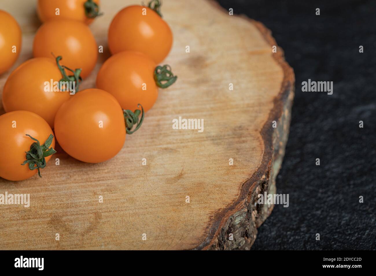 Close up photos of raw cherry tomatoes on wood board Stock Photo - Alamy