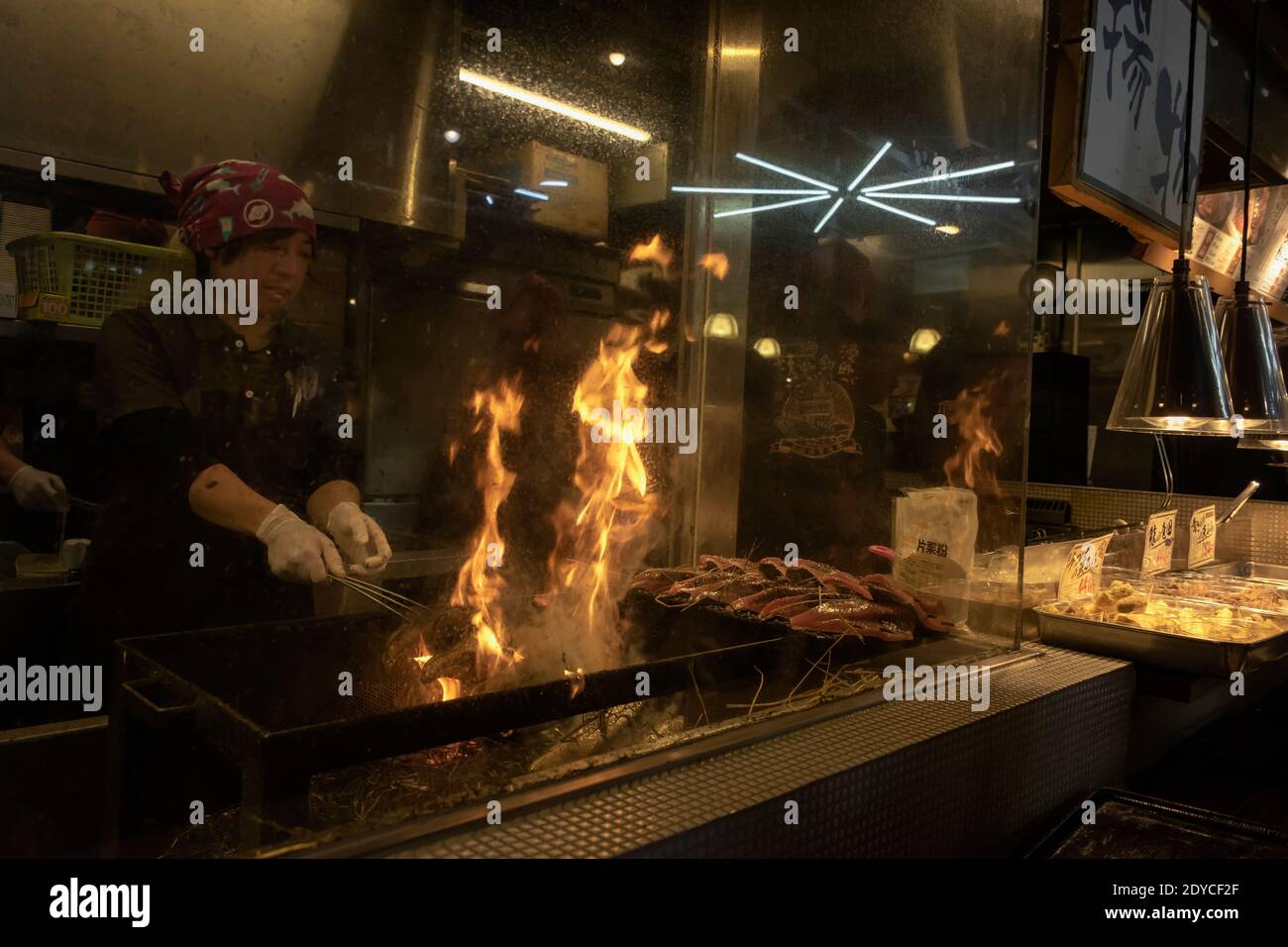 Cooking katsuo no tataki (seared bonito) over an open flame, Kochi, Japan Stock Photo