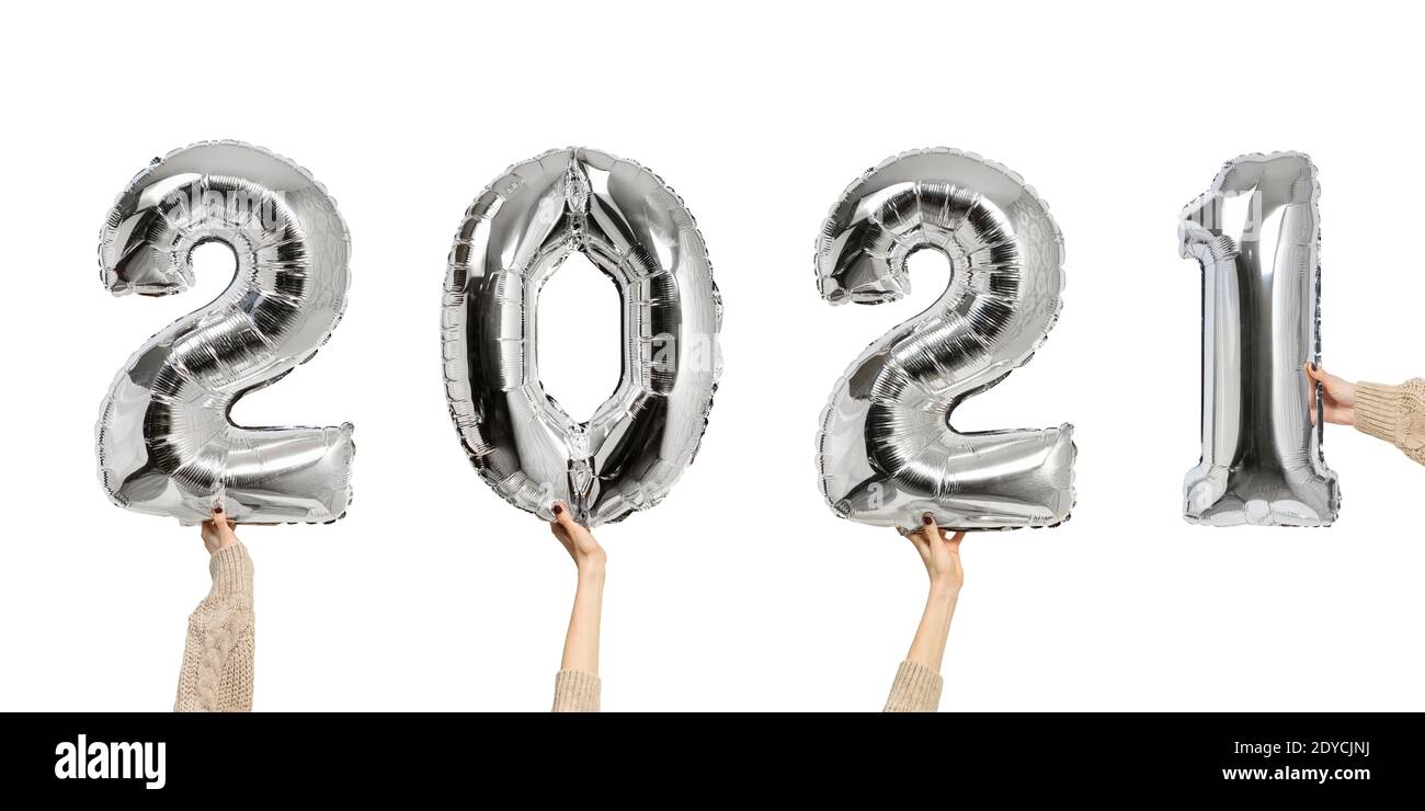 2021 Number of shiny balloons. Figures in female hands. White background. New  years concept Stock Photo - Alamy