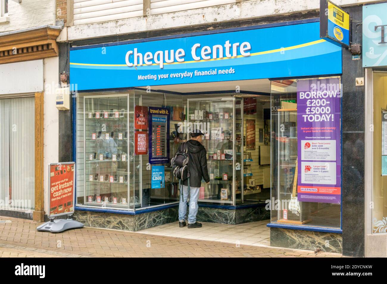 Premises of Cheque Centre loans company in High Street, King's Lynn. Stock Photo