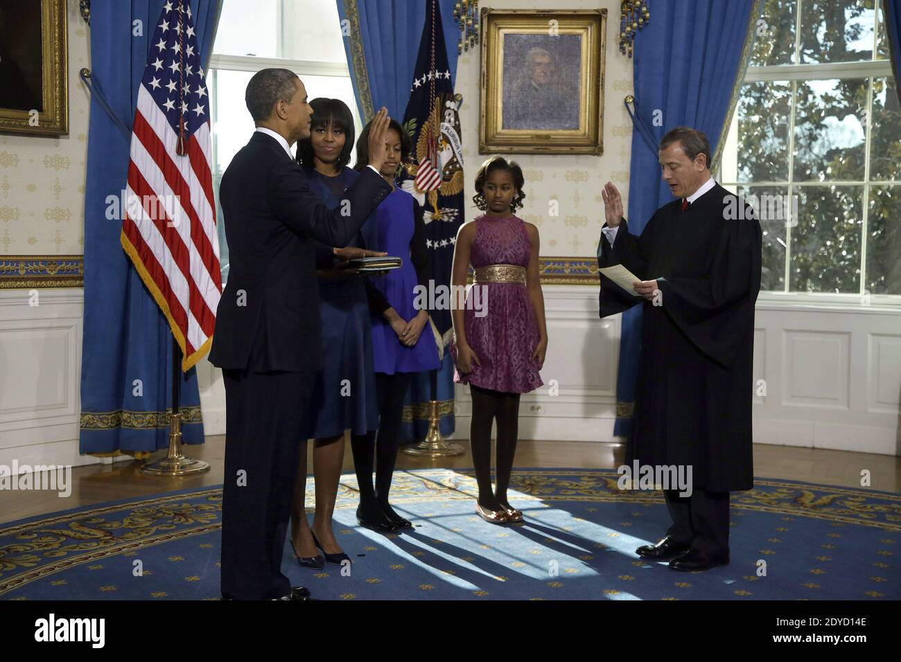 US Supreme Court Chief Justice John Roberts, Jr. administers the oath of office as US President Barack Obama is sworn in for a second term as President in the Blue Room of the White House January 20, 2013 in Washington, DC, USA. Obama was officially sworn in for his second term as the 44th President of the United States during the 57th Presidential Inauguration but will also participate in a ceremonial swearing in on Monday. Photo by Charles Dharapak/Pool/ABACAPTRESS.COM Stock Photo