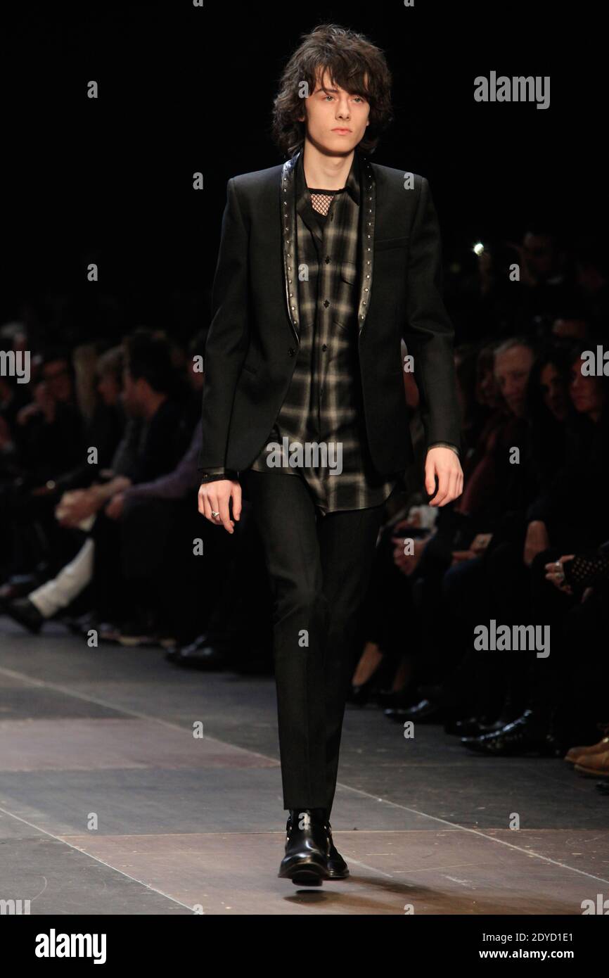 A model displays a creation by Hedi Slimane for Yves Saint-Laurent Men's  Fall-Winter 2013-2014 collection presentation as part of the Paris Fashion  Week, in Paris, France on January 20, 2013. Photo by